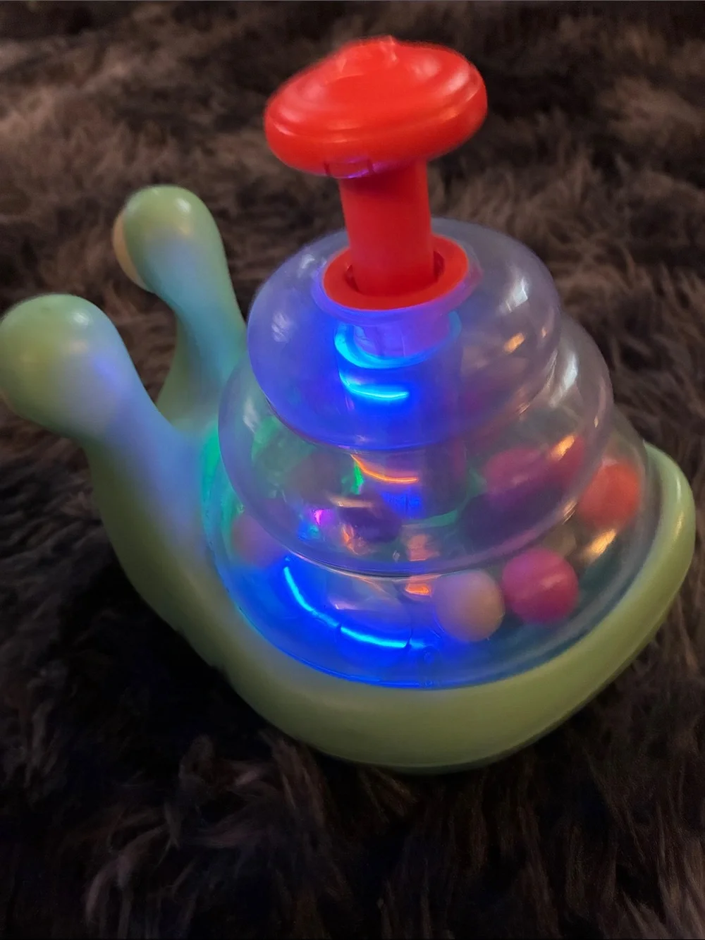 B. toys Light-up Snail Ball Popper Escar-Gloooooow roll